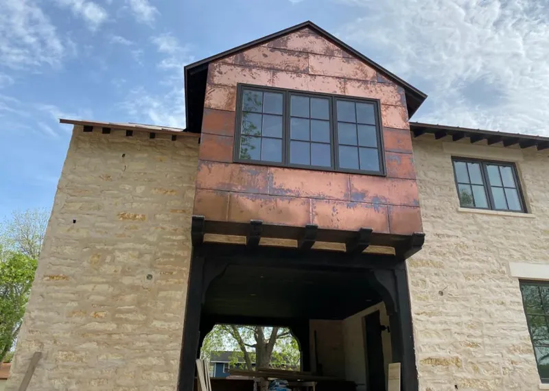 Copper metal panel facade on a stone building for Metal Roof Coating in Waikoloa Village