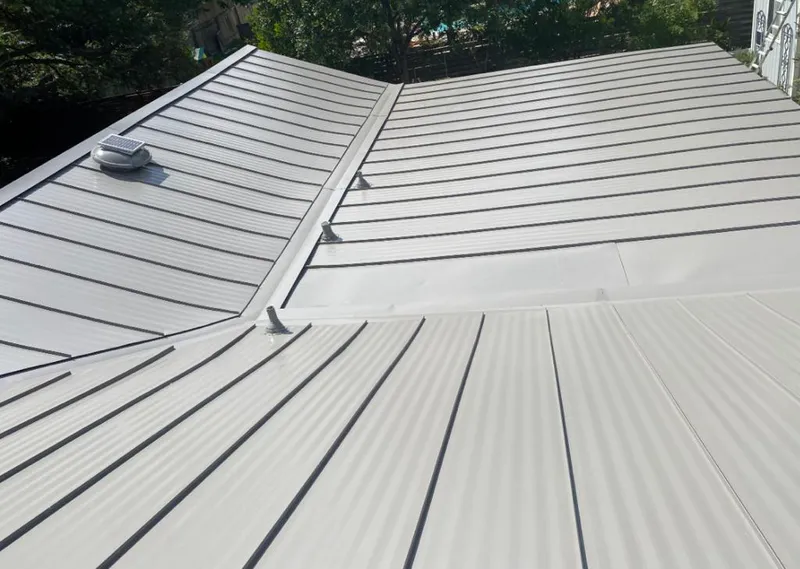 Solar attic fan installed on a metal roof for Roof Ventilation in Waikoloa Village